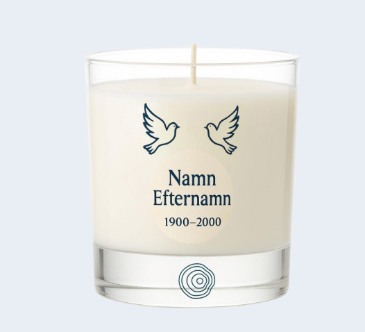 A white candle in a glass holder features two doves above the text "Namn Efternamn 1900–2000" with a circular design at the bottom.